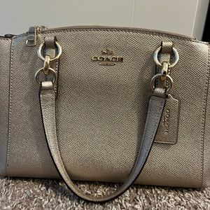 Champagne coach hand bag. Great condition.